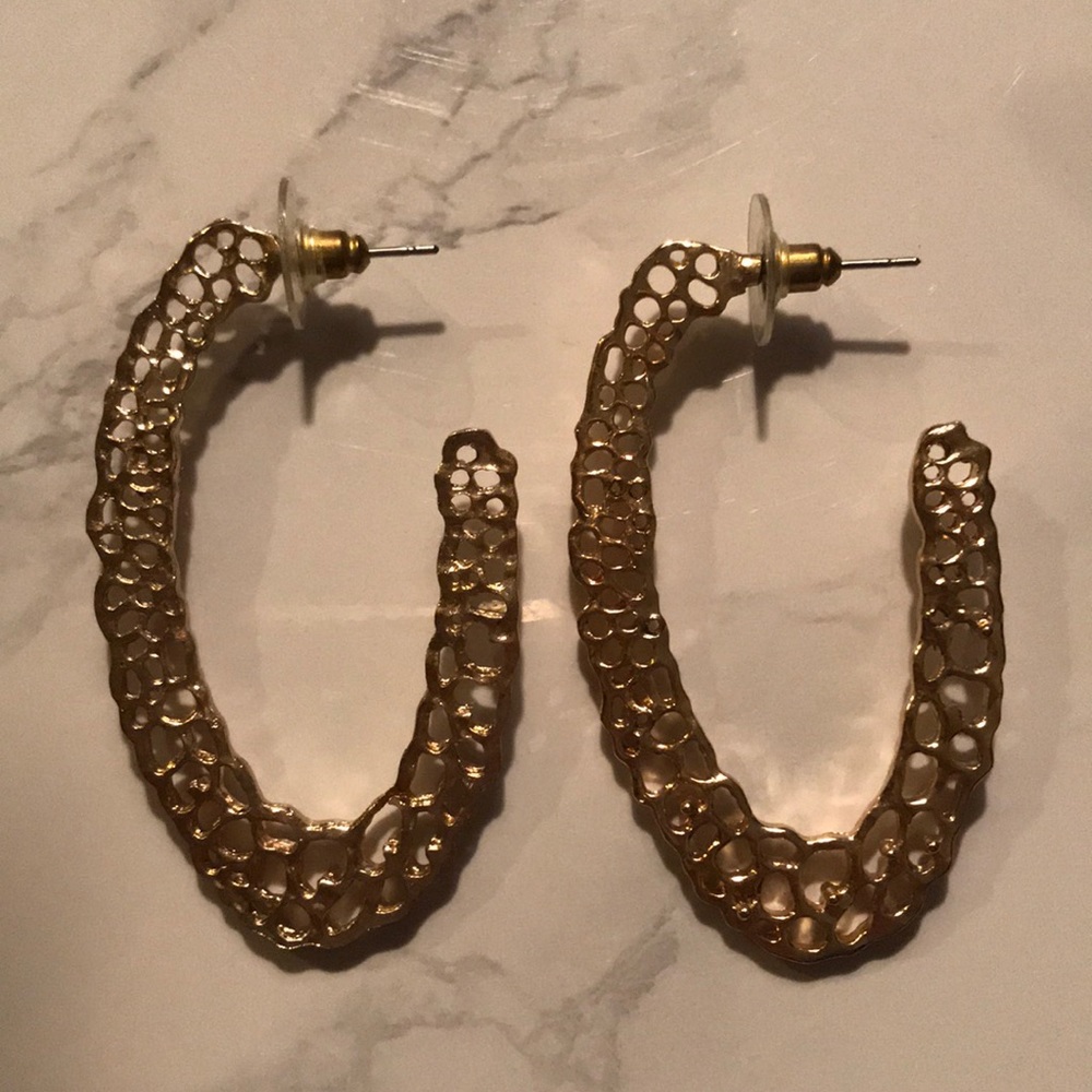 Large gold coloured earrings